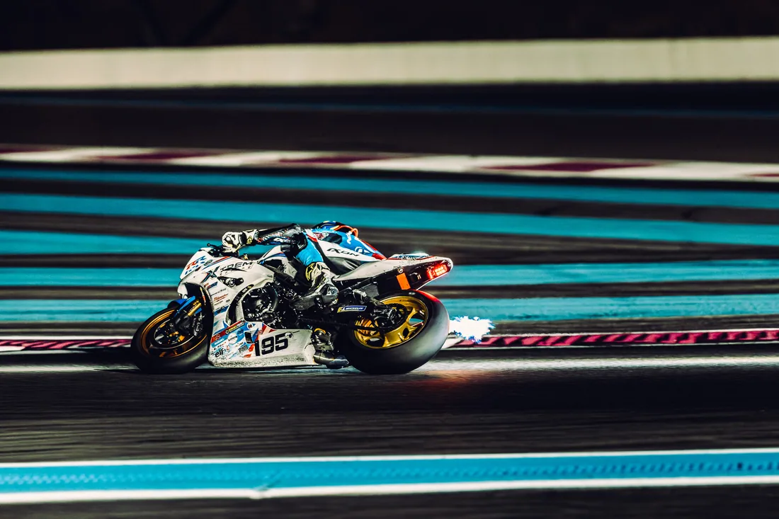 Artistic motorcycle panning photograph expressing the movement of the race