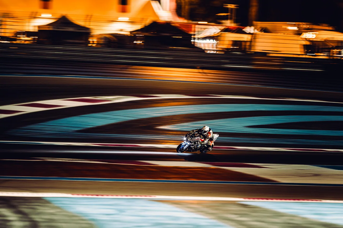 Motorcycle photographed with panning motion during a race at night at Circuit Paul Ricard