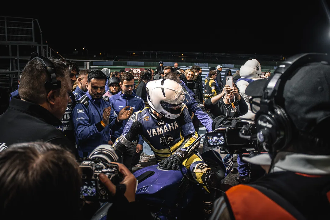 People and racing team photographed behind the scenes in the paddock